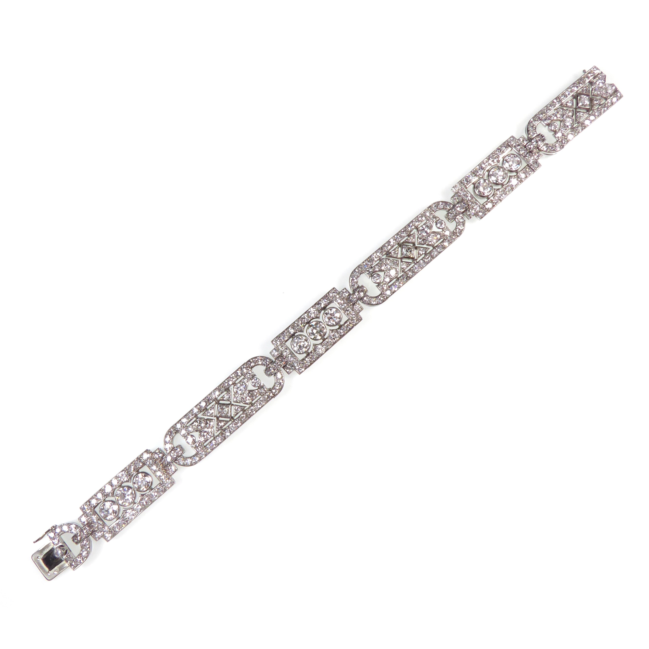 Art Deco diamond strap bracelet by Lacloche, Paris c.1925, alternating oblong and rectangular articulated sections,